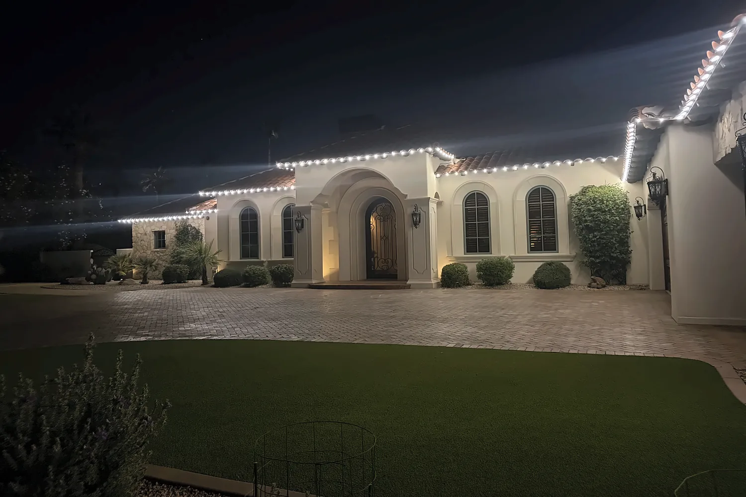 White C9 roofline over an arched entry